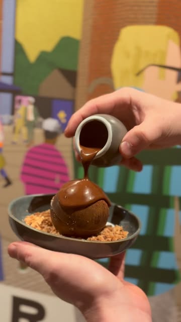 Chocolate sauce poured over a Vé•ra dessert